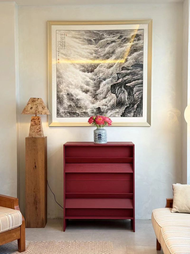 Tilt Chest in burgundy styled beneath a Chinese landscape painting