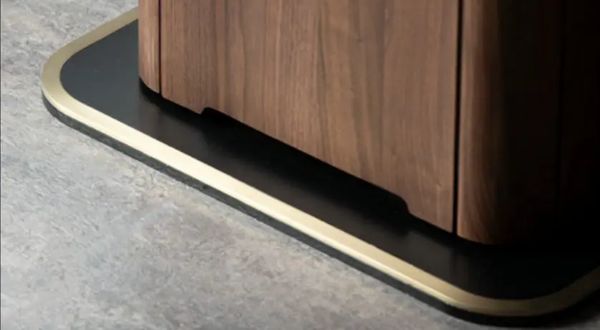 Brass-colour trim on the pedestal base of a black walnut automatic mahjong table